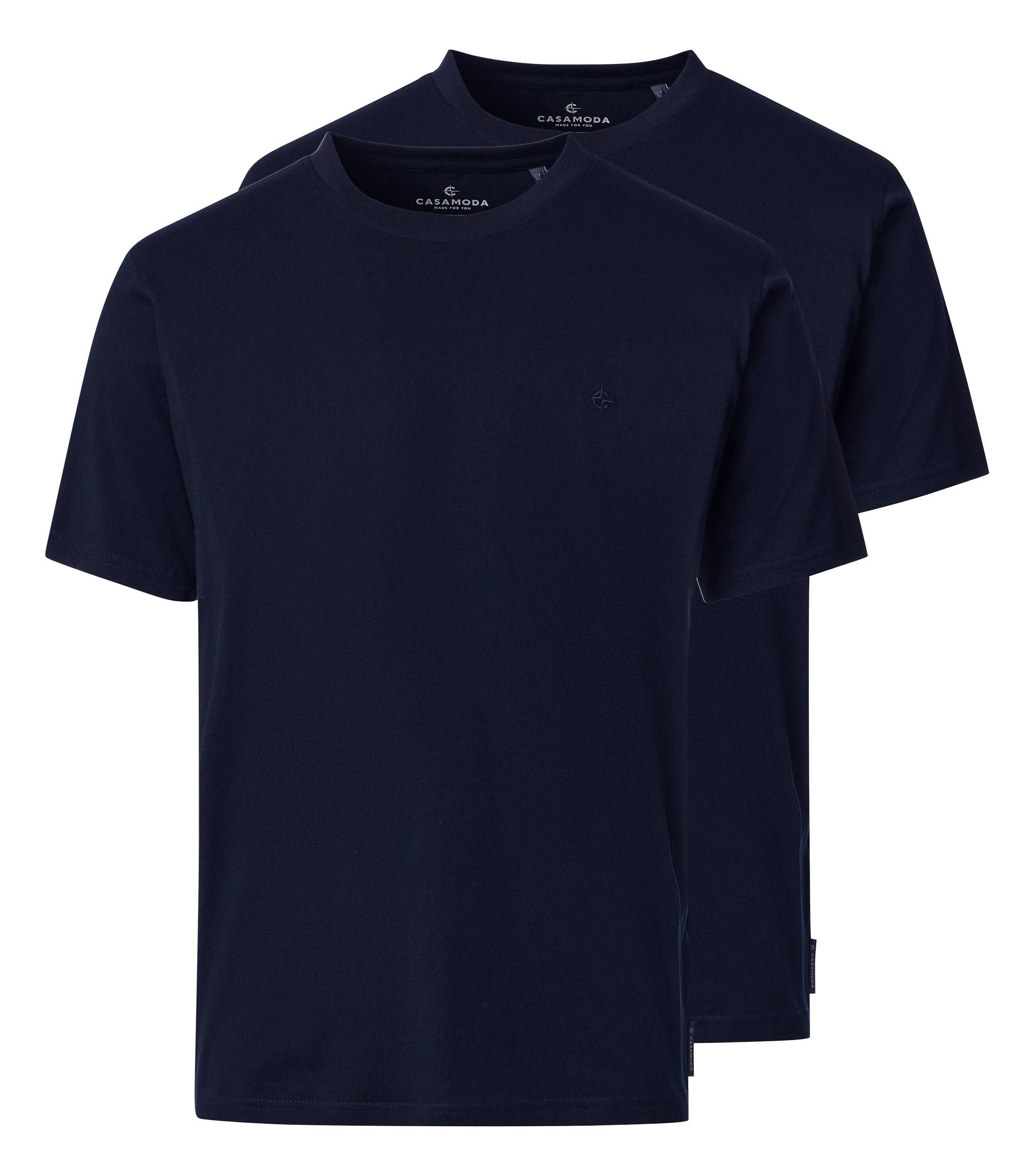 Das Model trägt ein T-Shirt im uni Muster in der Farbe Dunkelblau