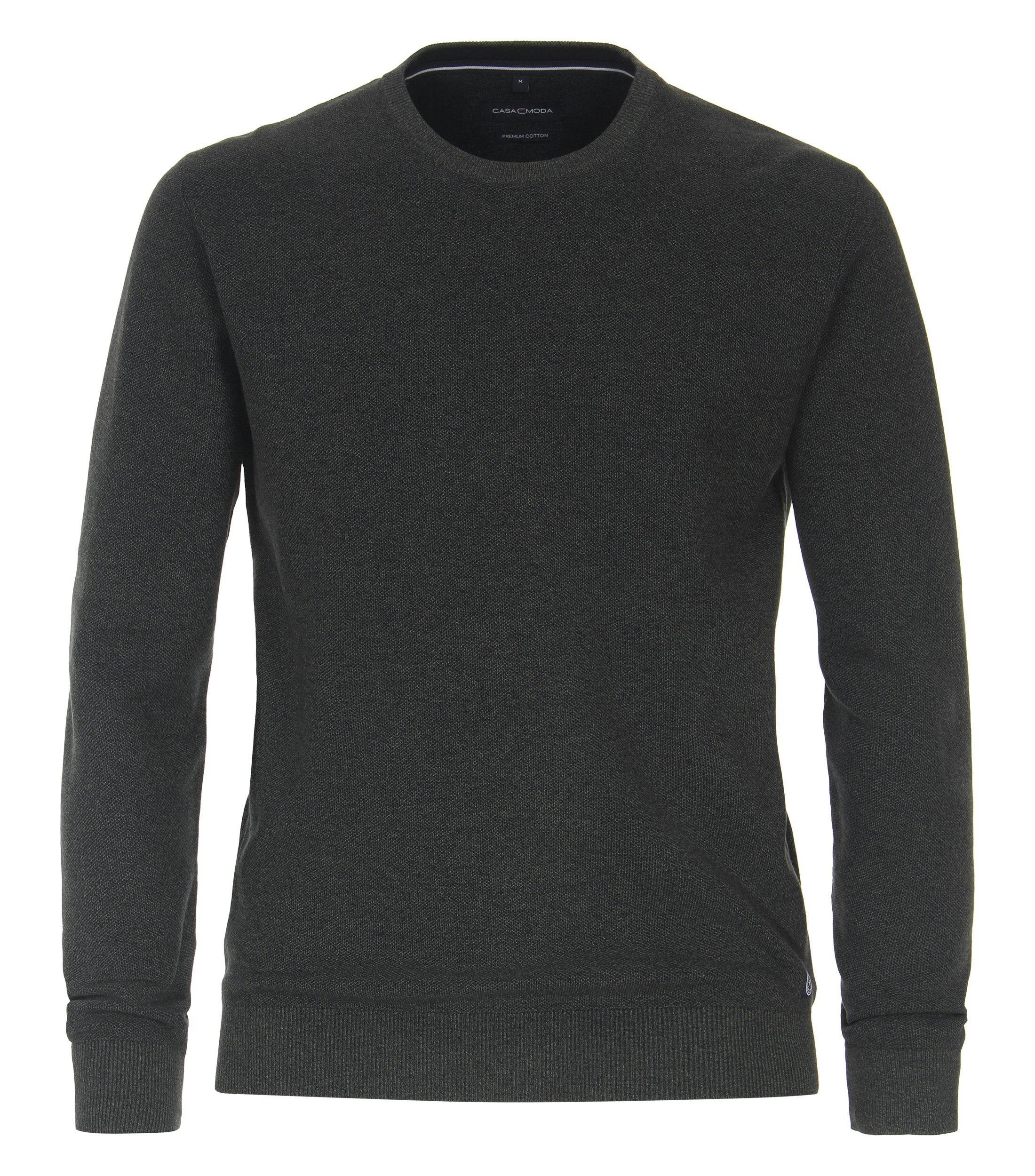 Das Model trägt ein Pullover im uni Muster in der Farbe Olive