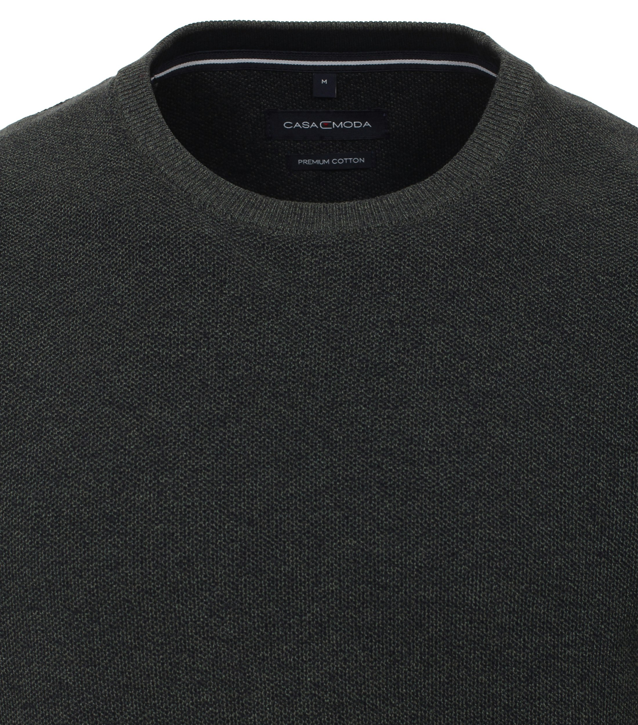 Das Model trägt ein Pullover im uni Muster in der Farbe Olive